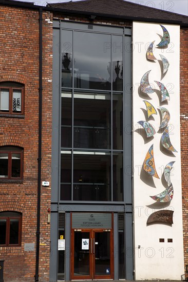 IRELAND, North, Belfast, "Cathedral Quarter, Cotton Court building, with mosiac patterns on the faced. A former cotton mill that hosts various art workshops including the Belfast Print Workshop."