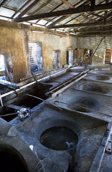 WEST INDIES, Grenada, St Patrick, The ancient copper vats for boiling the sugarcane juice at the River Antoine rum distillery.