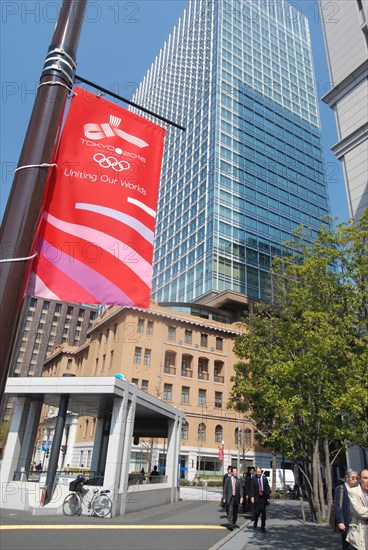 JAPAN, Honshu, Tokyo, "Marunouchi - by Tokyo station, banner on light pole supporting Tokyo's 2016 Olympic bid, men in suits walking to work"