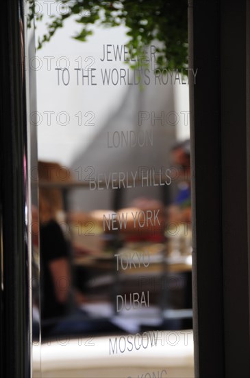 USA, California, Los Angeles, "Rodeo Drive. Shop sign with restaurant reflection, Two Rodeo"