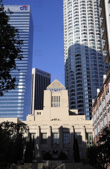 USA, California, Los Angeles, LA Central library dwarfed by sky scrapers of financial district