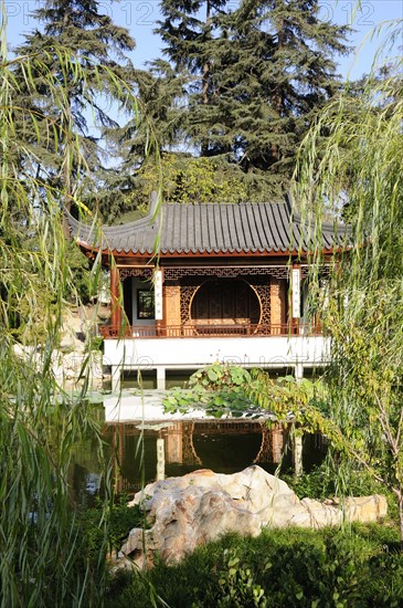 USA, California, Los Angeles, "View across lake to the Lotus Pavilion, Chinese Garden, The Huntington, Pasadena"