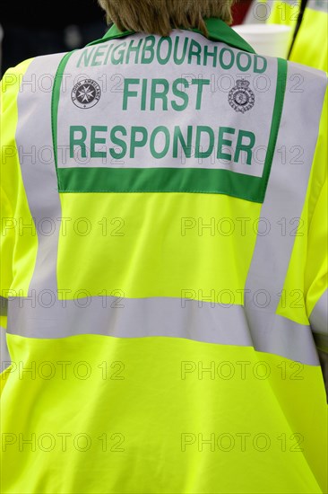 ENGLAND, West Sussex, Findon, Findon village Sheep Fair St Johns Ambulance Neighbourhood First Response person in yellow reflective coat.