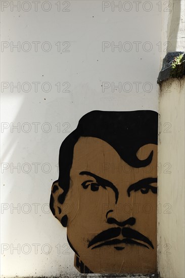 ENGLAND, East Sussex, Brighton, "Little East Street, Mural of mans Head sprayed on wall."