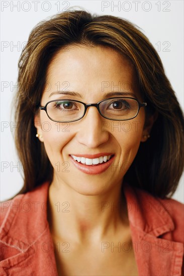 PEOPLE, Adult, Female, Portrait of a mid adult woman smiling and wearing glasses.