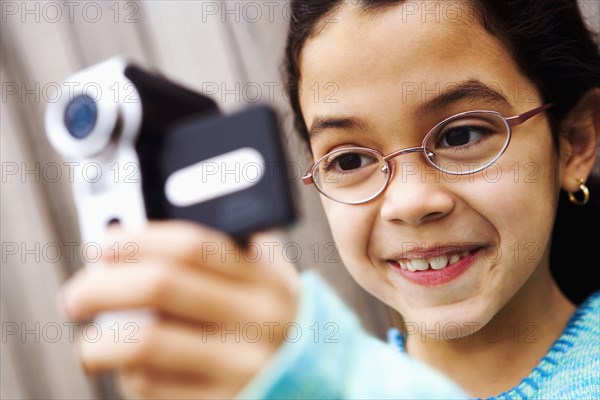 PEOPLE, Girls, Young, Close-up of a girl filming with a home video camera.