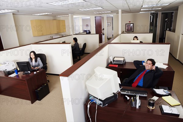 BUSINESS, Offices, Open Plan, Business executives working in an office.