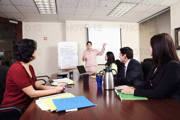 BUSINESS, Offices, Meeting, Business executives at a meeting in a conference room.