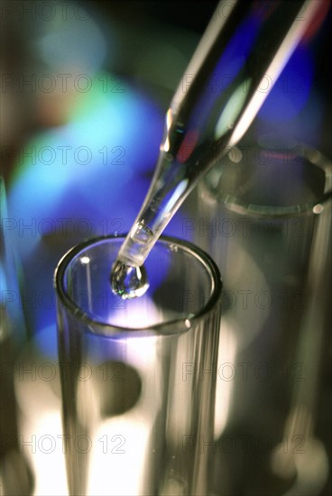 MEDICAL, Laboratory, Test Tubes, Pipette dropping liquid into test tube.