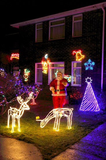 ENGLAND, West Sussex, Southwick, Cul de Sac of houses decorated with fairy lights for Christmas.