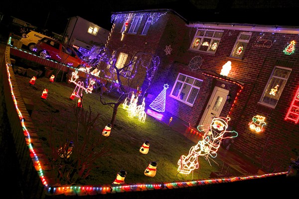 ENGLAND, West Sussex, Southwick, Cul de Sac of houses decorated with fairy lights for Christmas.