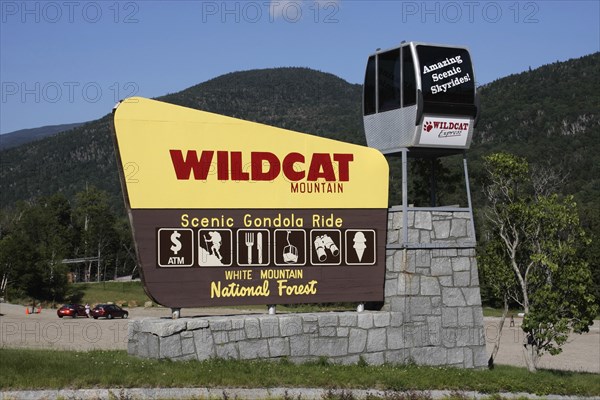 USA, New Hampshire , White Mountains, Wildcat Mountain ski area out of season. Sign advertising cable car rides.