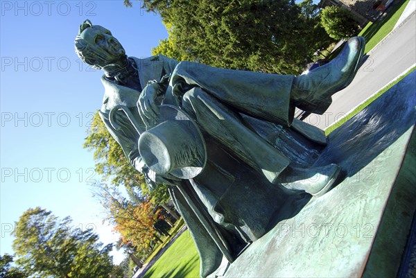 USA, New York State, Cooperstown, Statue of James Fenimore Cooper in Cooper Park next to Baseball Hall of Fame.