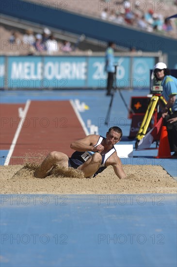 SPORT, Athletics, Long Jump, "Scotland's Darren Ritchie during the Long Jump landing in the sand. 2006 Commonwealth Games, Melbourne, Australia."