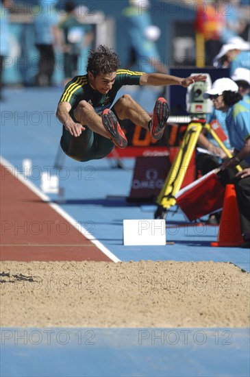 SPORT, Athletics, Long Jump, "Australian Fabrice Lapierre during the long Jump in mid leap. 2006 Commonwealth Games, Melbourne, Australia."
