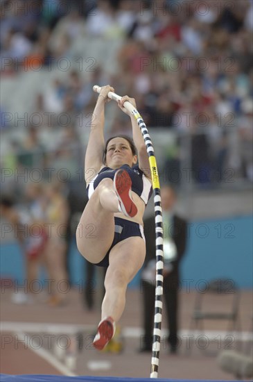 SPORT, Athletics, Pole Vault, "Scotlands Pole Vaulter Kirsty Maguire at the beginging of her assent with the pole bent. 2006 Commonwealth Games, Melbourne, Australia."