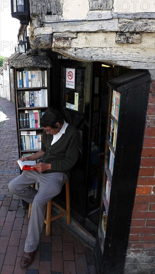 ENGLAND, East Sussex, Lewes, "High Street, Keere Street cobbled pathway with traditional buildings and 15th century bookshop."