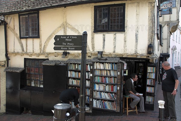 ENGLAND, East Sussex, Lewes, "High Street, Keere Street cobbled pathway with traditional buildings and 15th century bookshop."