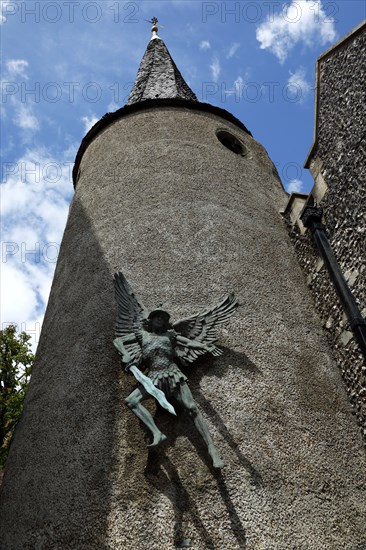 ENGLAND, East Sussex, Lewes, "High Street, St Michael's Church detail with sculpture of the Arcangel."