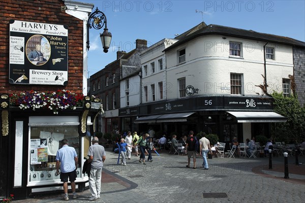 ENGLAND, East Sussex, Lewes, "Cliffe High Street, Harvey's Brewery shop and Bills Produce Store and Cafe."