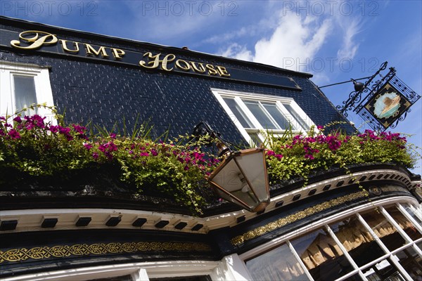 ENGLAND, East Sussex, Brighton, The Lanes The Pump House one of the oldest pubs in the city with flower in window boxes.