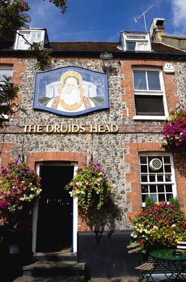 ENGLAND, East Sussex, Brighton, The Lanes The Druids Head one of the oldest pubs in the city dating from 1510 with flower in hanging baskets.