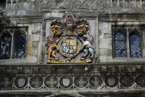 ENGLAND, Wiltshire, Salisbury, "Detail of weather worn North Gate in the High Street. Royal Coat of Arms with Diev et mon Droit written in latin, meaning God and my Right."