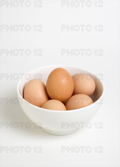 FOOD, Uncooked, Eggs, Free range eggs in a bowl on a white background.