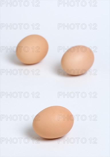 FOOD, Uncooked, Eggs, Three free range eggs on a white background.