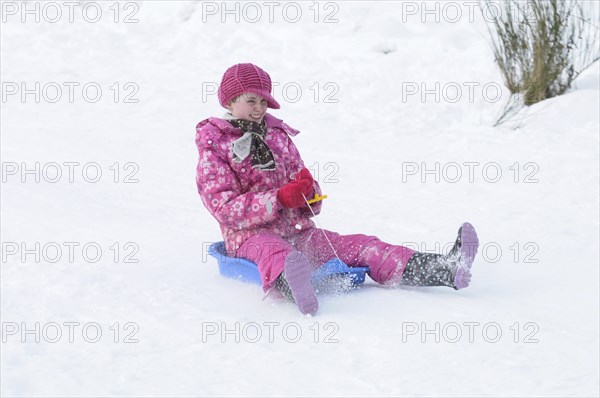 WEATHER, Winter, Snow, "Young girl sledding down hill. Perth, Scotland. "