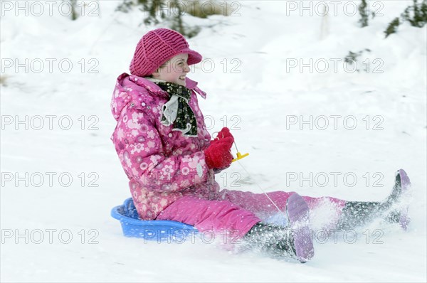 WEATHER, Winter, Snow, "Young girl sledding down hill. Perth, Scotland. "