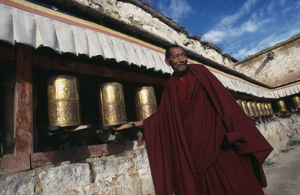 CHINA Tibet  Lhasa Monk turning prayer wheels at Sera MonasteryAsia Chinese Chungkuo Jhongguó Zhongguó Asian Religious