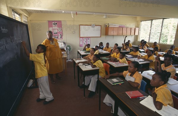 ST LUCIA  Castries Children and teacher in classroom at Carmen Rene Memorial school.Windward Islands