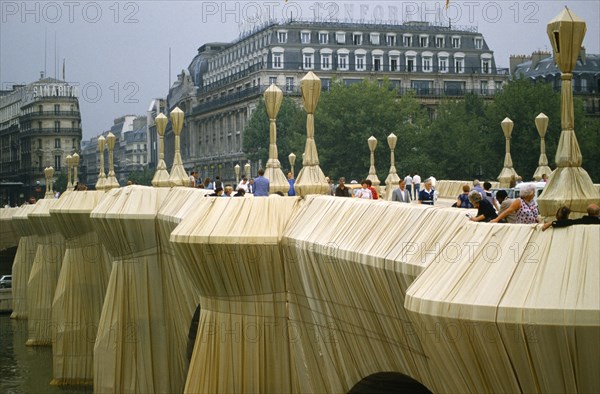 France, Ile de France, Paris, The Pont Neuf bridge across River Seine wrapped by the artist Christo as an installation sculpture.