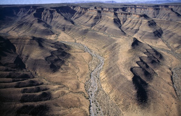 Namibia, Naukluft Mountains, Aerial view over eroded mountain landscape and dried up river bed.