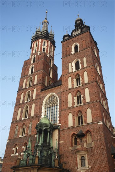 Poland, Krakow, Mariacki Basilica or Church of St Mary overlooking the Rynek Glowny the market square.
