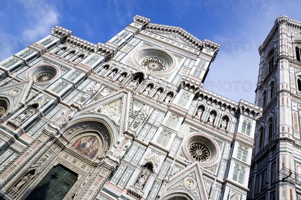 ITALY, Tuscany, Florence, The Neo-Gothic marble west facade of the Cathedral of Santa Maria del Fiore the Duomo and Giotto's Campanile bell tower.