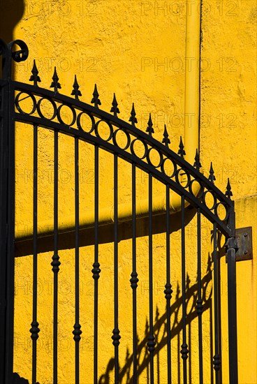 IRELAND, COunty Galway, Connemara, Clifden, Colourful gate and wall.