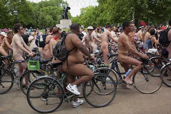 ENGLAND, London, Hyde PArk, Naked people riding their bicycles on formation at Hyde Park while participating at the world naked bike ride protest parade.