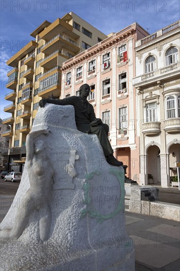 Cuba, Havana, Centro Habana, Sculpture sacred to the memory of martyr Cuban poet J.C. Zenea surrounded by Art Deco and Art nouveau buildings at the begin of Prado street.