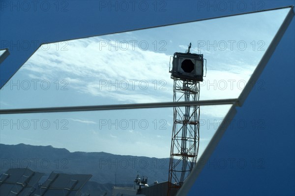 Environment, Energy, Solar Power, Reflection in a large tilting mirror used to direct the sunlight on to a solar panelled tower at a Solar Power plant in Almeria, Spain.