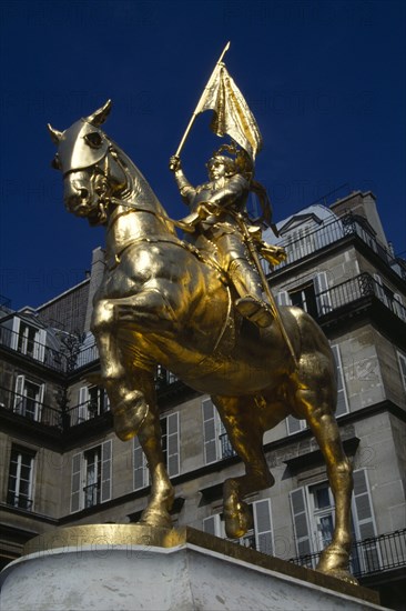 France, Ile de France, Paris, Gilded golden bronze statue of Joan of Arc on horseback in armour carrying her standard by Fremiet in Place des Pyramids in the Tuileries Quarter a focus of pilgrimage for Royalists.