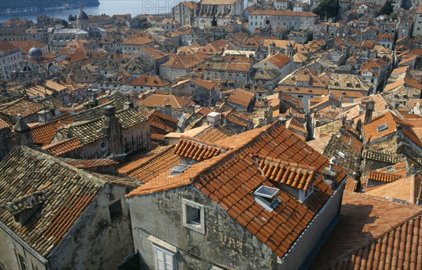 Croatia, Dubrovnik, View over city architecture across tiled terracotta rooftops.