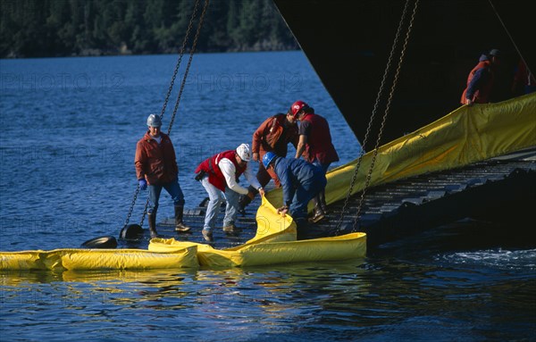 USA, Alaska, Cordova, Oil Spill prctice drill, deploying and retrieving containment booms.