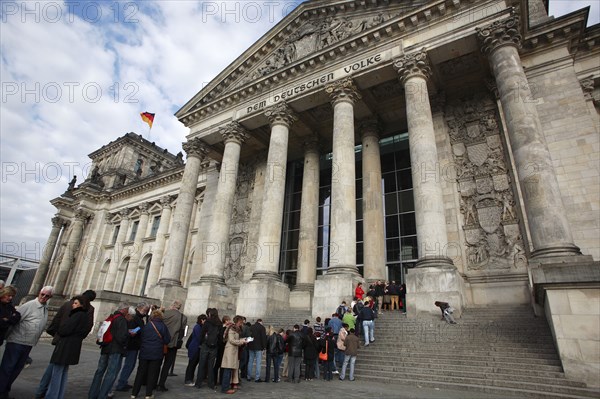 Germany, Berlin, visitors queueing at entrance to the Reichstag.