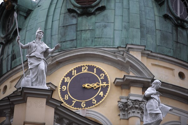 Germany, Berlin, Charlottenburg Palace, Statues & clock face on dome.