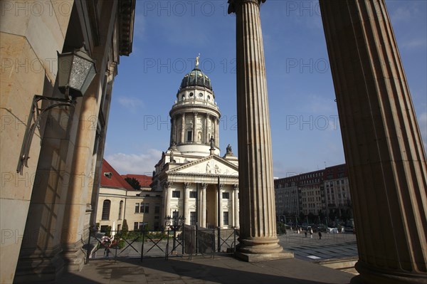 Germany, Berlin,Gendermenmarkt,  Franzosischer Dom French Cathedral seen through the columns of the Concert House.