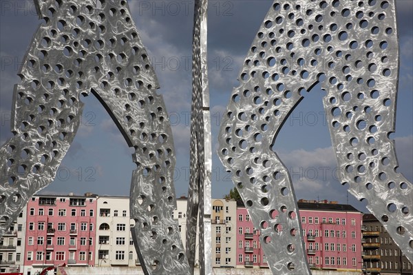 Germany, Berlin, Detail of Molecule Men sculpture 30 metres in height by Jonathan Borofsky on River Spree.