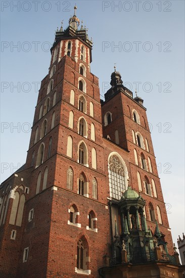 Poland, Krakow, Mariacki Basilica or Church of St Mary overlooking the Rynek Glowny the market square.