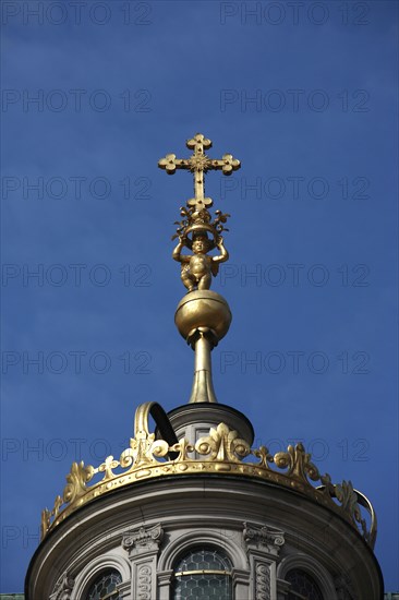 Poland, Krakow, Crucifix on dome of Wawel Cathedral.